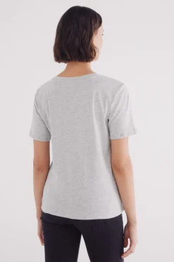 Camiseta ojales metálikcos mangas