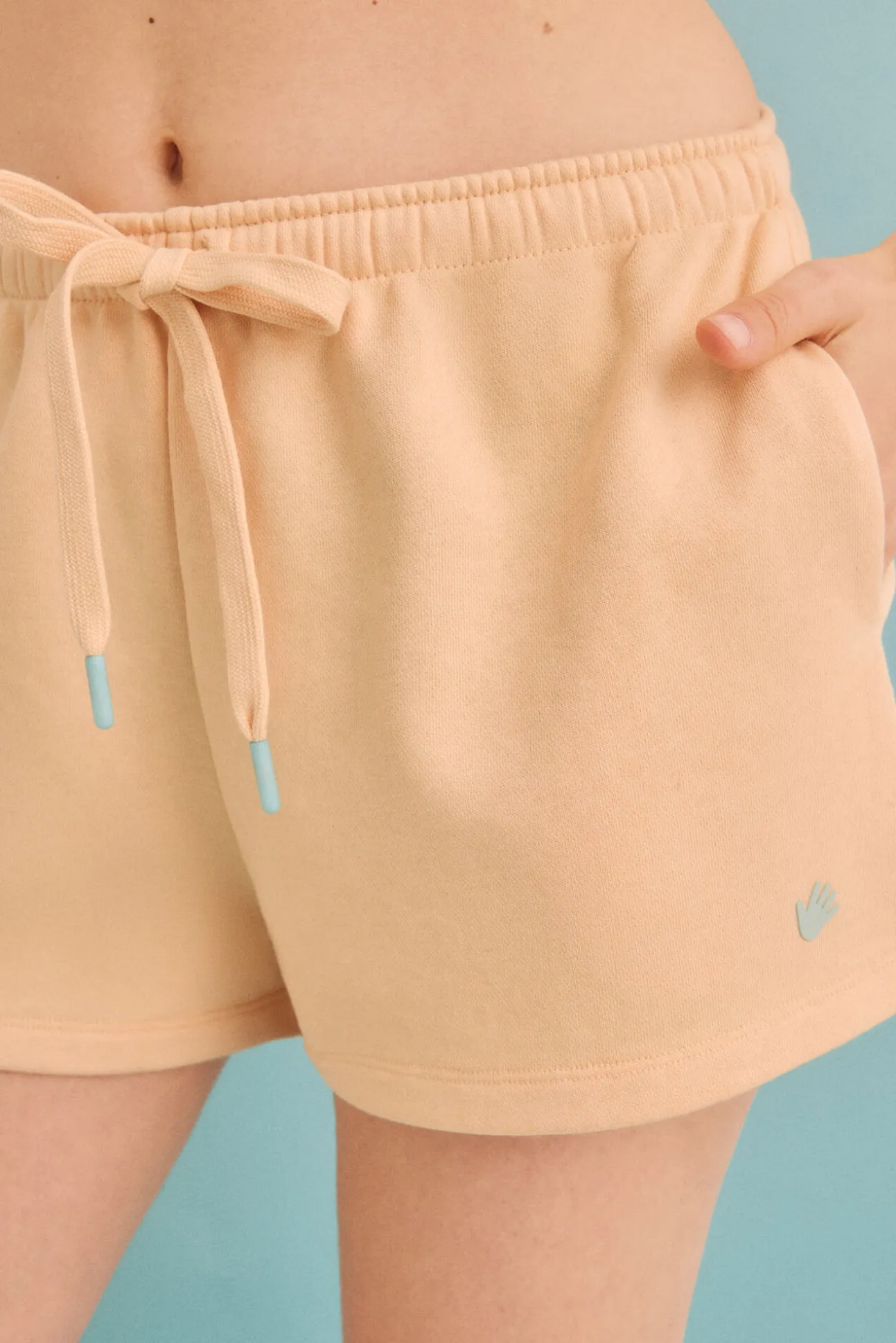 Pantalón corto felpa naranja