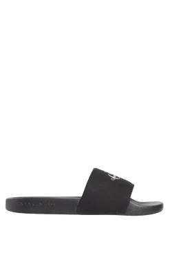 Sandalias slides con logo grabado.